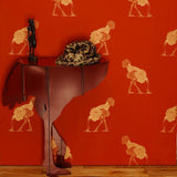 Ostrich 05 by Beware the Moon in Australia. Gold Ostriches on a rich red wallpaper.